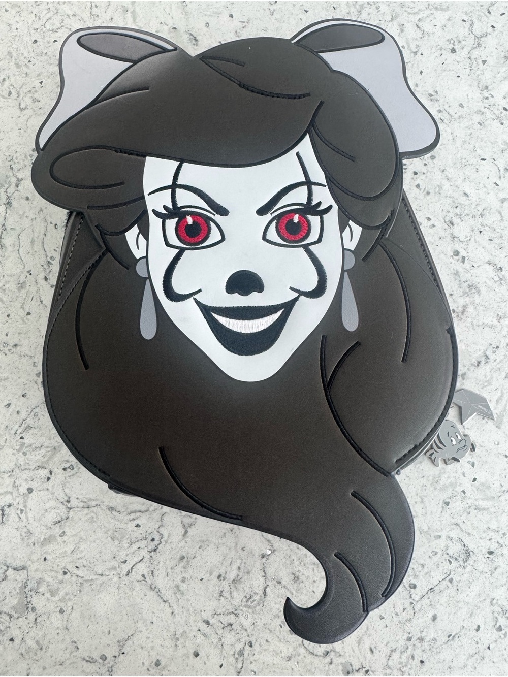 Magically horrific backpack. Ariel/ Pennywise